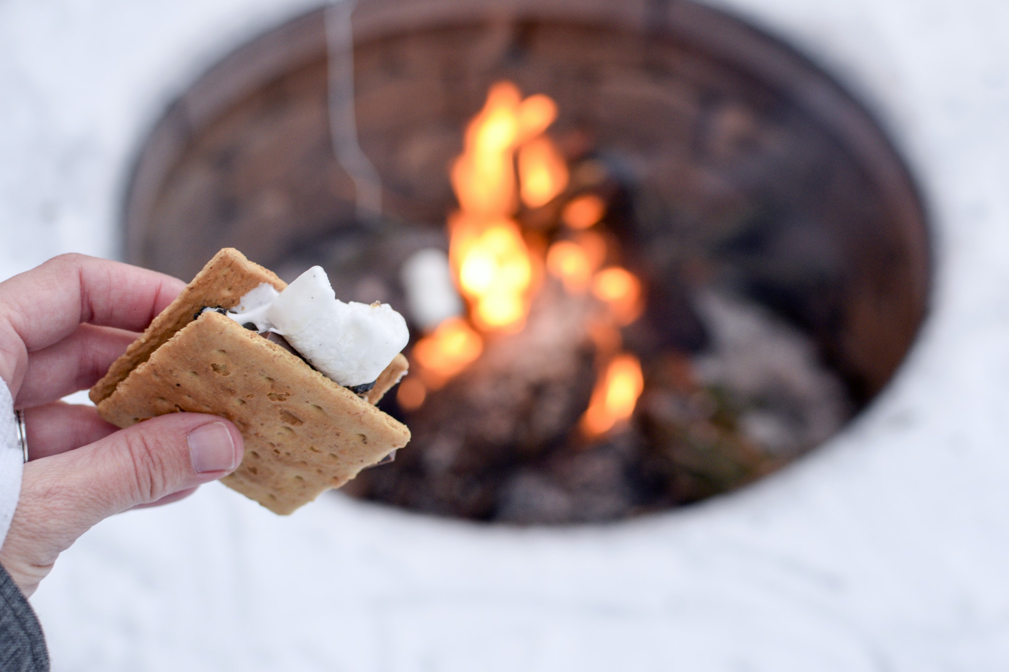 S’mores by a campfire in the winter